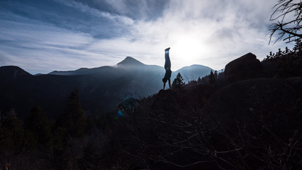 Motivational poster success hand stand in the mountains get in shape fitness