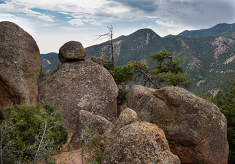 Little boulder on big rock mountain view