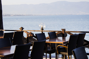 Tables in a cafe on the beach. Selective focus.