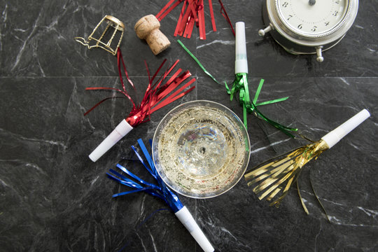 Glass Of Champagne With New Year Eve Party Favors