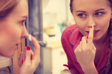 Woman applying moisturizing skin cream. Skincare.