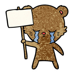 crying cartoon bear with sign post