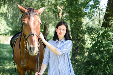 Young girl with a horse