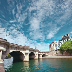 Naklejka premium Pont Neuf bridge on Seine river in Paris, France, on a bright sunny day