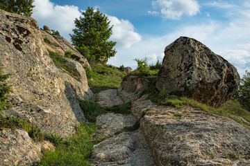 Fototapeta na wymiar Ancient road with tire tracks left on stones