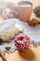 Still life with cup of coffee or cacao, Apples and gingerbread cookies with icing sugar decoration. Winter holidays background