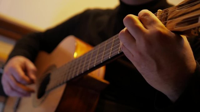 4k Musician plays classic compositions by acoustic guitar at recording studio
