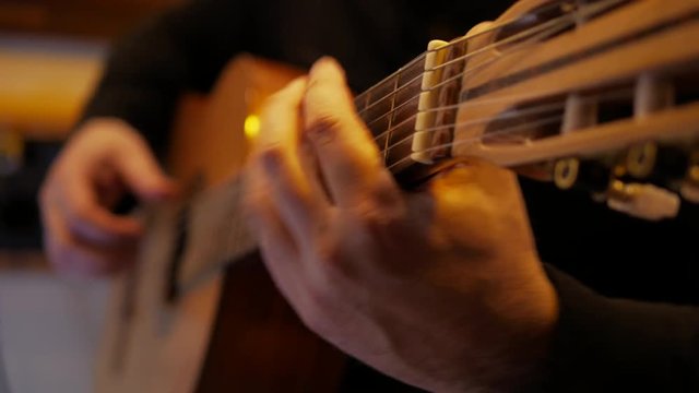4k Guitarist plays interesting classic music by acoustic guitar at record studio