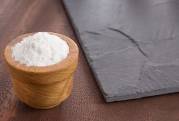 Baking soda in the wooden bowl