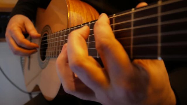 4k Studio recording of musician by acoustic guitar him music