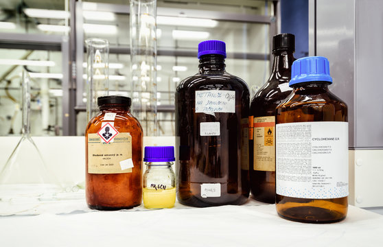 Bottles with chemicals on the desk in laboratory