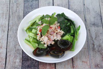 Spicy cucumber salad with dried shrimp and  preserved egg.