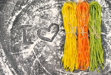 Colorful pasta on a black background 
