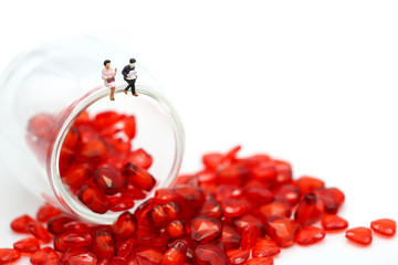 Miniature people: Couple and valentine decorations character with copy space using as background valentine day, Love couple concept