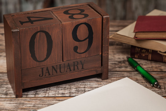 Perpetual Calendar in desk scene with blank diary page, January 9th