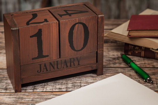 Perpetual Calendar in desk scene with blank diary page, January 10th