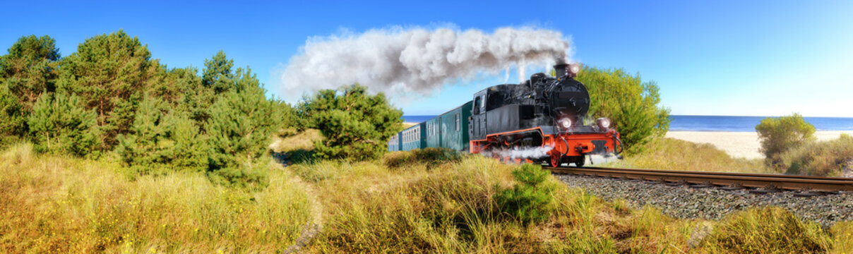 Fototapeta Historical German steam train in spring, Rugen, Germany