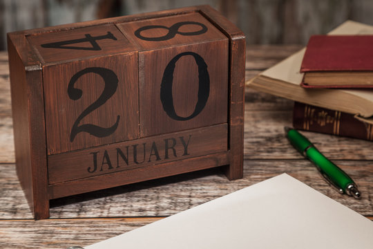 Perpetual Calendar in desk scene with blank diary page, January 20th