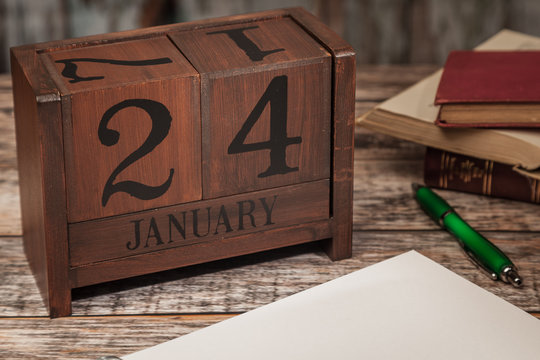 Perpetual Calendar in desk scene with blank diary page, January 24th