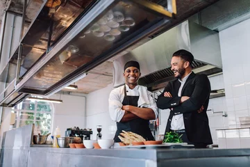 Foto op Plexiglas Smiling restaurant owner and chef standing in kitchen © Jacob Lund