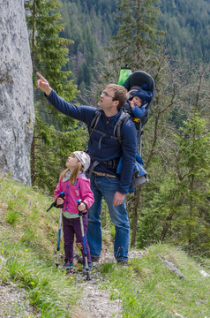Family hike along the the rocky hill