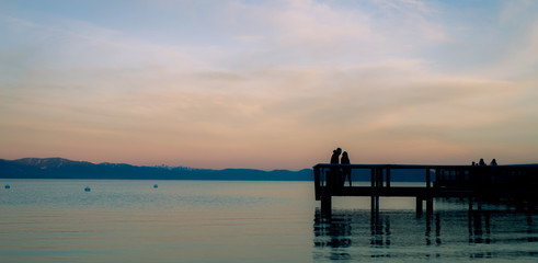 Fototapeta premium Morning Pier, and a couple about to kiss