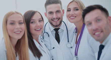 Cheerful team of doctors and interns make selfie