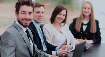 Business colleagues looking at camera in the office