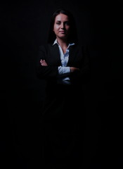 Full-length portrait of businesswoman  isolated on black backgro