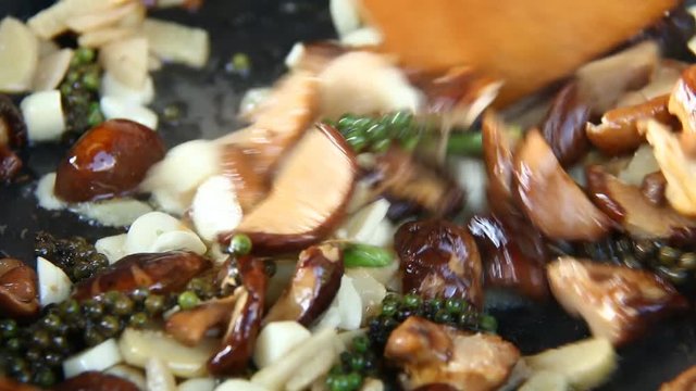 Frying  ginger shiitake and celery root  in pan