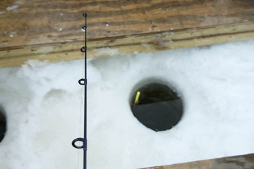 Short fishing pole ice fishing on Lake of the Woods in Minnesota