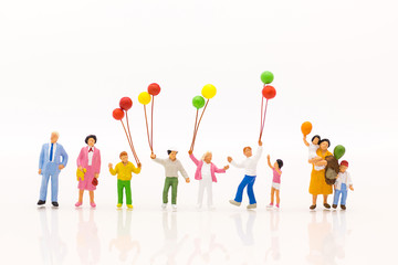 Miniature people: Childrens play balloon together wiht fun, using as background International day...