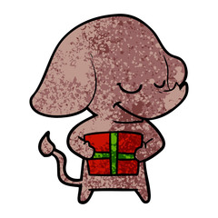 cartoon smiling elephant with present
