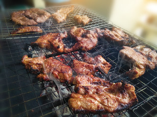 closeup of meat grilled on stove,celebration party in family with delicious barbecued ribs and beef...