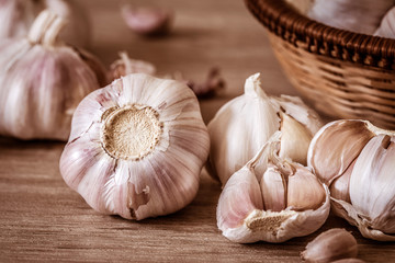 Close up a group of garlic on kitchen wooden table