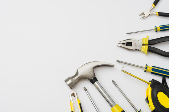 Work Tools Lined Up On A White Background.