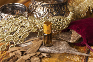 Agarwood, also called aloeswood, essential oil and incense chips