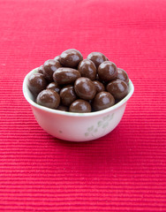 chocolate balls. chocolate balls in bowl on a background
