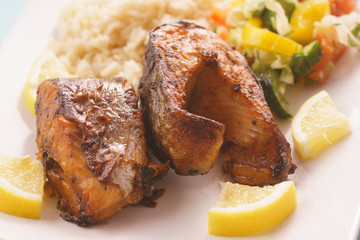 Fried trout with rice, lemon