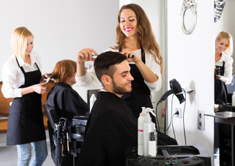 Hairdresser doing hairstyle