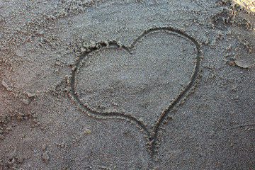 Heart draw in beach sand