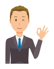 A young businessman is playing an okay sign