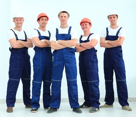 team of professional builders in helmets