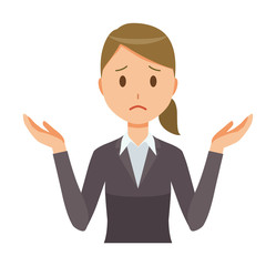 A business woman in a suit is shrugging her shoulders
