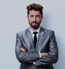 Close up portrait of a smiling handsome business man  over white