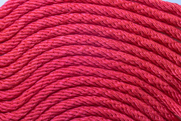 Close up pattern of red rope lines.