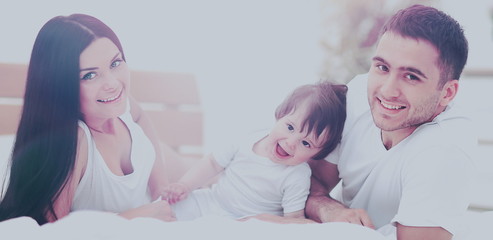 family with young children to bed in the bedroom
