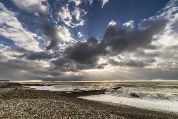 Sunset over the sea, storm and seagulls