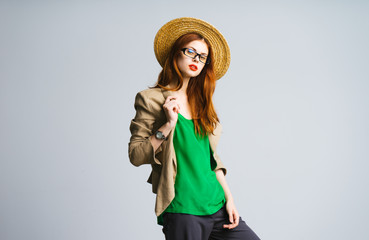 Beautiful stylish young woman in a jacket and hat. Casual business lady
