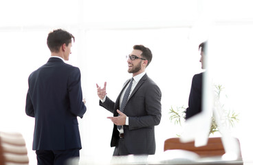 employees of the company standing in the office